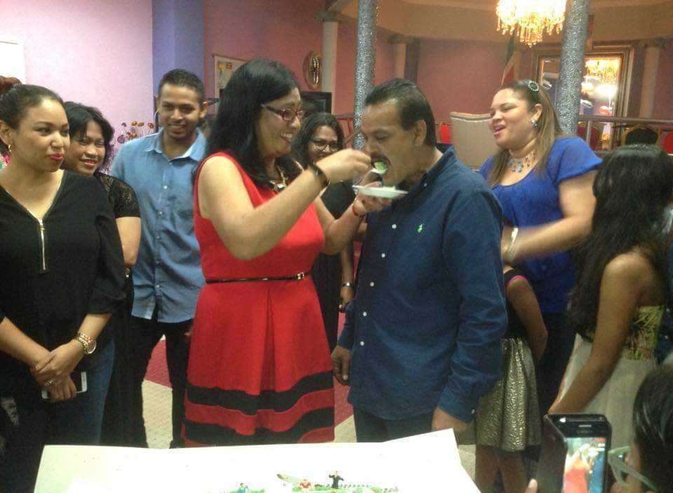 Mohamed Haroenkhan Abdul celebrating with cake