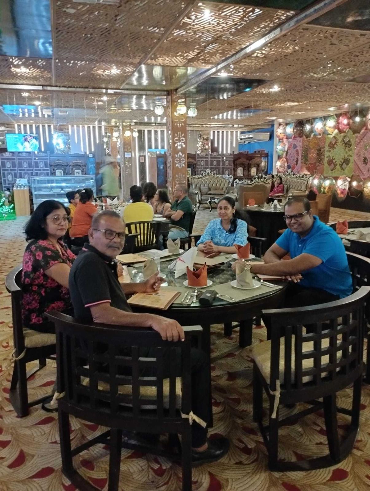 Mohamed Haroenkhan Abdul with family at a restaurant