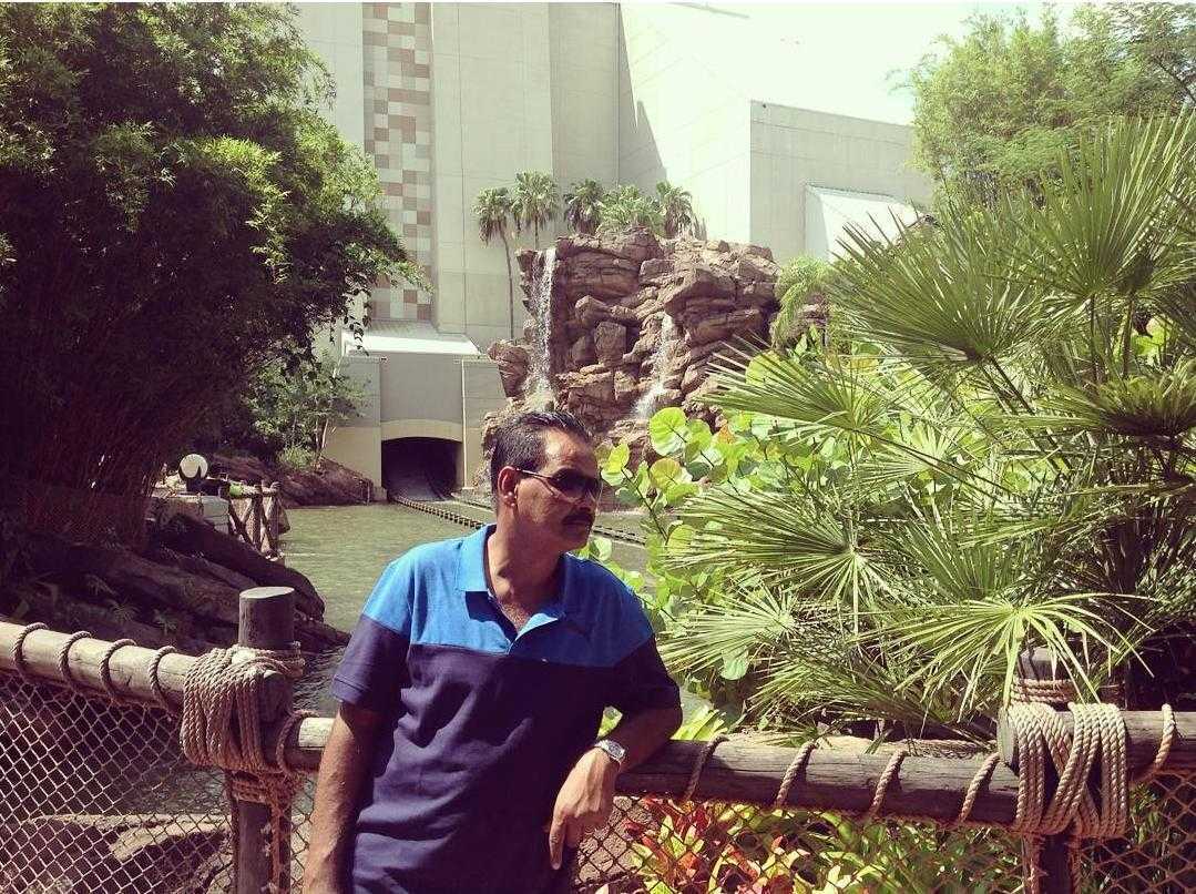 Mohamed Haroenkhan Abdul on a garden walkway