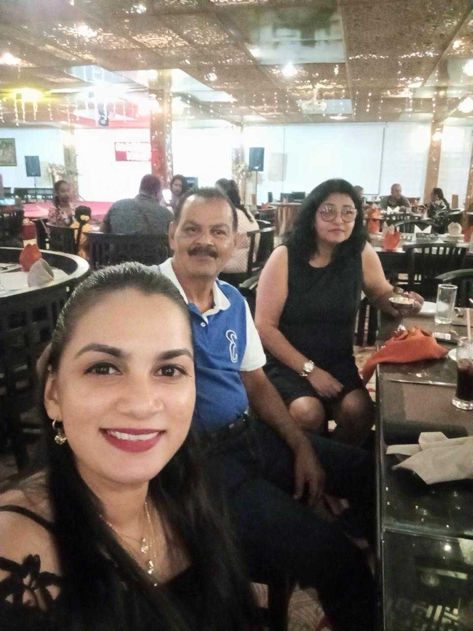 Mohamed Haroenkhan Abdul with family at an evening celebration